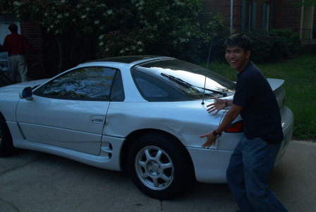 Steven displaying his car like Vanna White